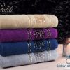 Stack of Goldi luxury hand towels in various colors with a plush wavy texture, symbolizing Egyptian quality and Syrian craftsmanship. Luxury hand towel - Egyptian cotton towel - Goldi Hand Towel