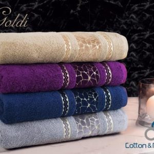 Stapel luxe Goldi-handdoeken in verschillende kleuren met een pluche golvende textuur die kwaliteit uit Egypte en vakmanschap uit Syrië symboliseert. Goldi Handoek 90x50