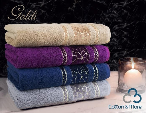 منشفة جسم جولدي للحمام بألوان متنوعة وبنسيج متموج يُظهر الحرفية الفاخرة. قطن مصري