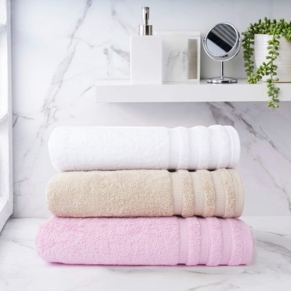 Elegant Windsor Bath Towels in white, beige, and pink, set against a marble backdrop for a refined bathroom ambiance Egyptian Cotton